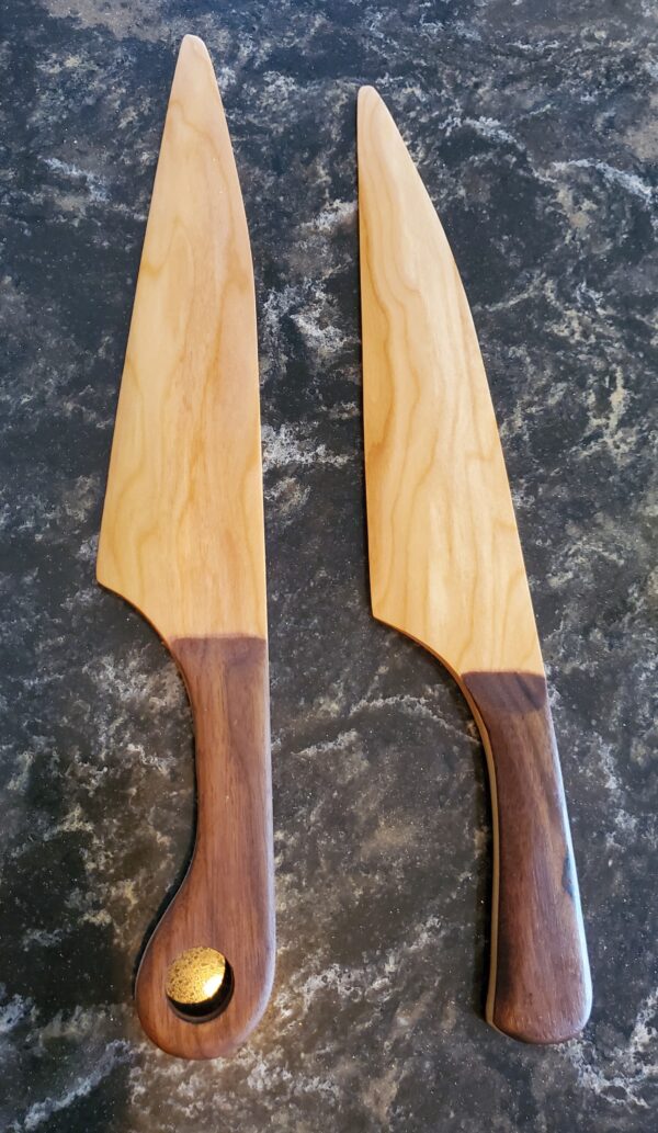 Wedding cake knives with cherry handles and walnut grips.