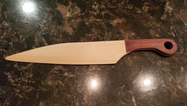 Wedding cake knife with cherry handles and walnut grips.