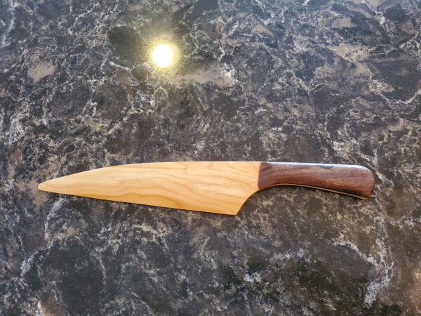 Wedding cake knife with cherry handles and walnut grips.